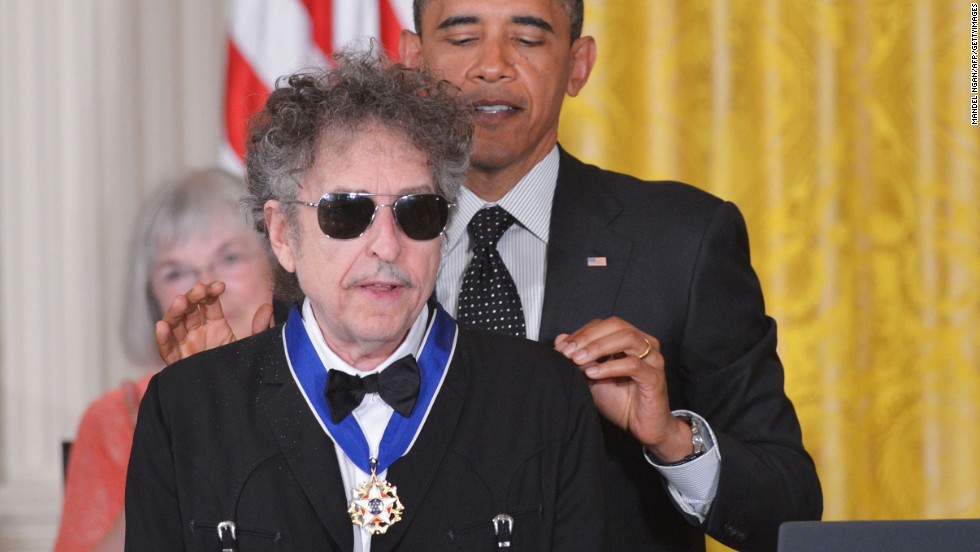 President Barack Obama presents the Presidential Medal of Freedom to Dylan in the East Room of the White House in 2012. The award is the country&#39;s highest civilian honor. &quot;I remember, you know, in college, listening to Bob Dylan and my world opening up, &#39;cause he captured something about this country that was so vital,&quot; Obama said. 