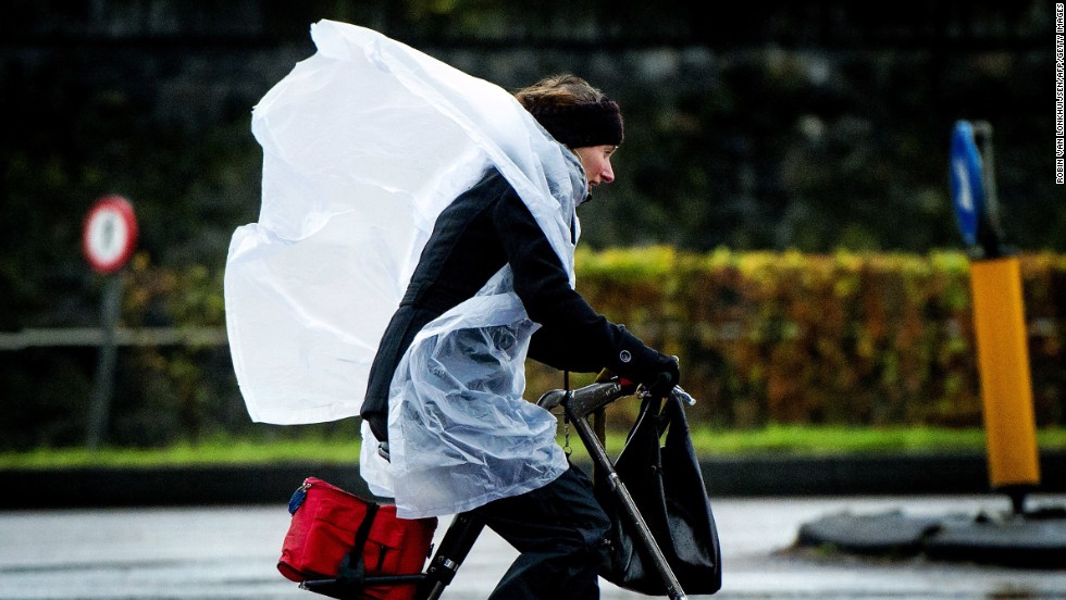 A woman fights the wind as she cycles in Amsterdam, Netherlands, on December 5.