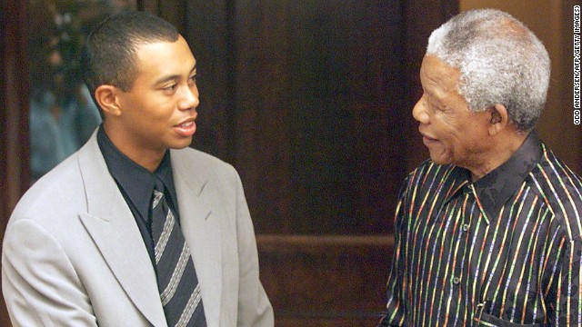 A youthful Tiger Woods meets Nelson Mandela for the first time in 1998 shortly after winning the U.S. Masters. 