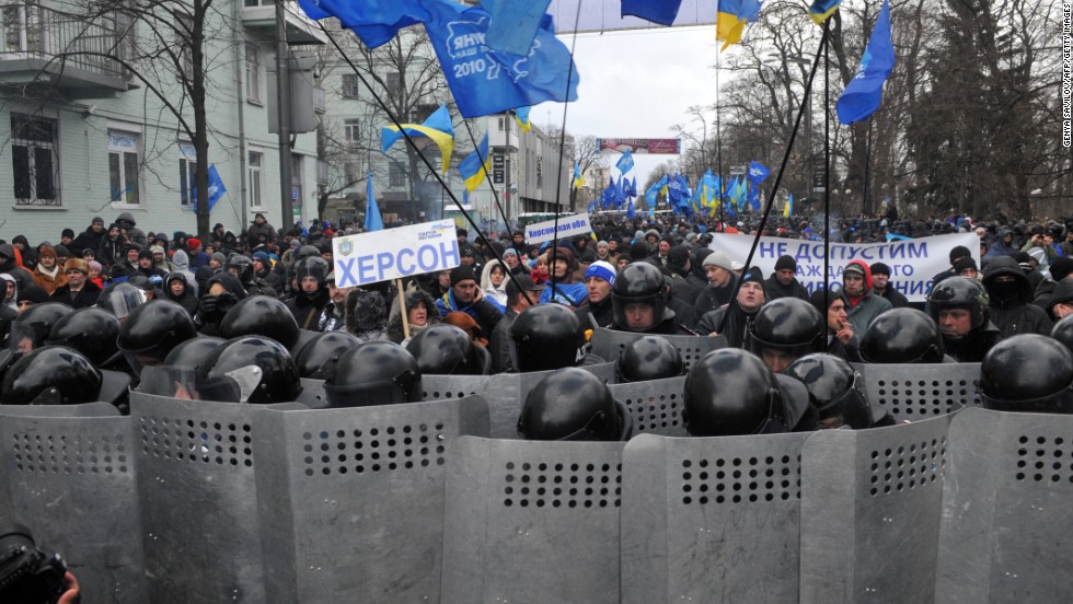 Riot police block protesters during the December 8 rally.