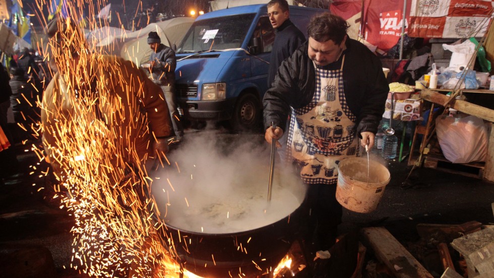 Protesters prepare food at a camp in Independence Square on December 7.