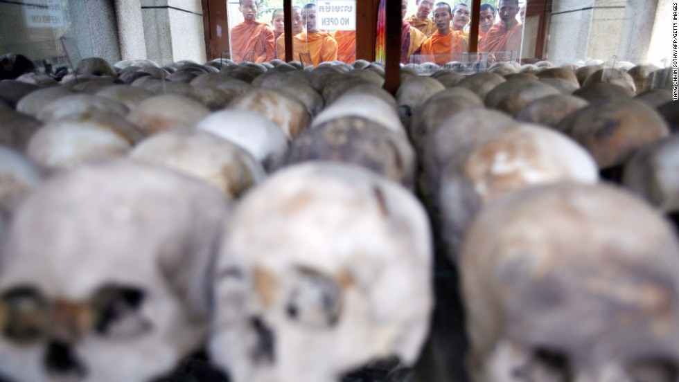 Cambodian Buddhist monks bless victims&#39; skulls at the Choeung Ek Killing Fields memorial in Phnom Penh on April 17, 2008. 