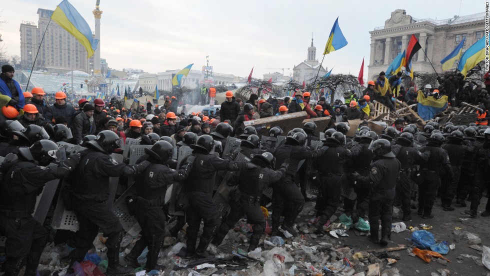 Protesters who oppose Yanukovych clash with anti-riot police in Independence Square on December 11.