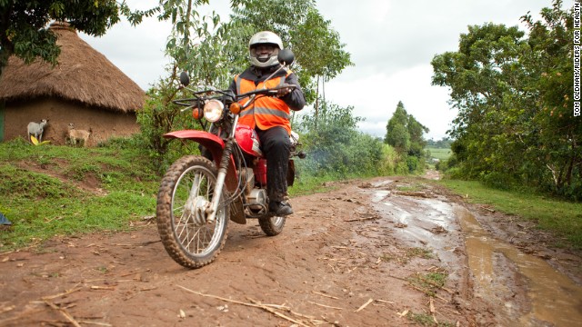 Misheck Mafemera, a health care worker, uses his motorcycle to see people in villages in the Seke district of Zimbabwe. 
