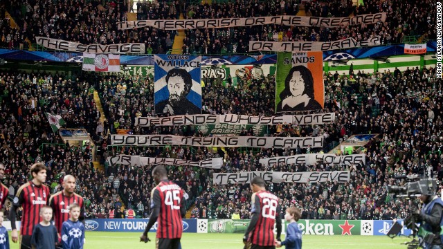 Celtic&#39;s Green Brigade fans raise banners before a game against AC Milan. The result: A fine of 50,000 euros and angry executives.
