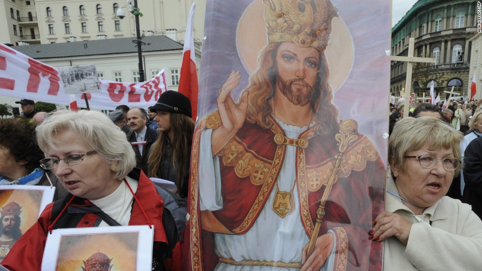 Women carry a religious painting as hundreds of Roman Catholics march through Warsaw&#39;s downtown demanding more religion in social and political life in Poland on September 19, 2010. 