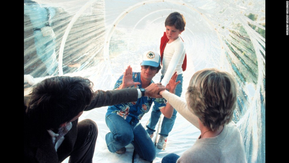 Spielberg, wearing a hat, works with actors Peter Coyote, Henry Thomas and Dee Wallace during the filming of &quot;E.T.; The Extra-Terrestrial&quot; in 1982. As of 2013, the movie had made more than $792 million worldwide.