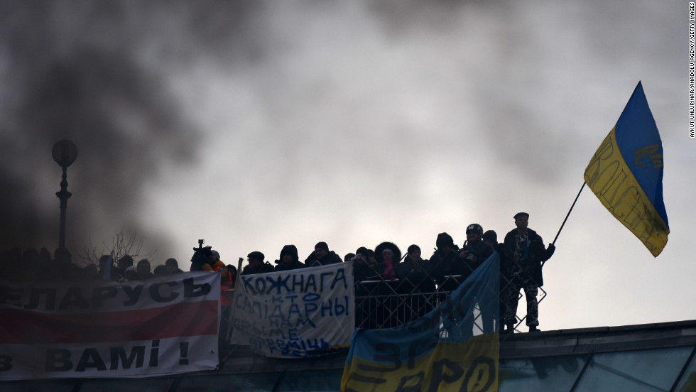 Smoke rises as Ukrainian protesters continue their anti-government demonstrations in Independence Square on December 15.