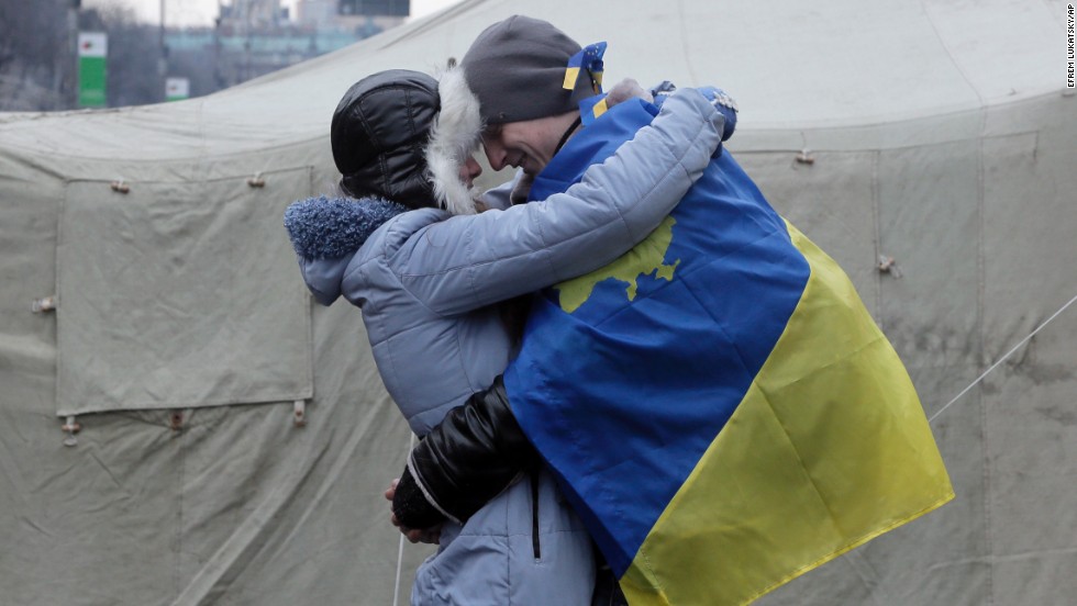 A couple of pro-EU activists share a tender moment at a tent camp in Kiev on December 15.