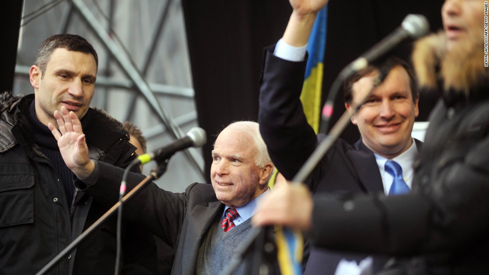U.S. Sens. John McCain, center, and Chris Murphy, right, join Ukrainian opposition leader Vitali Klitschko during a mass rally at Independence Square on December 15. McCain told protesters seeking closer ties with Europe, &quot;The free world is with you, America is with you.&quot; 