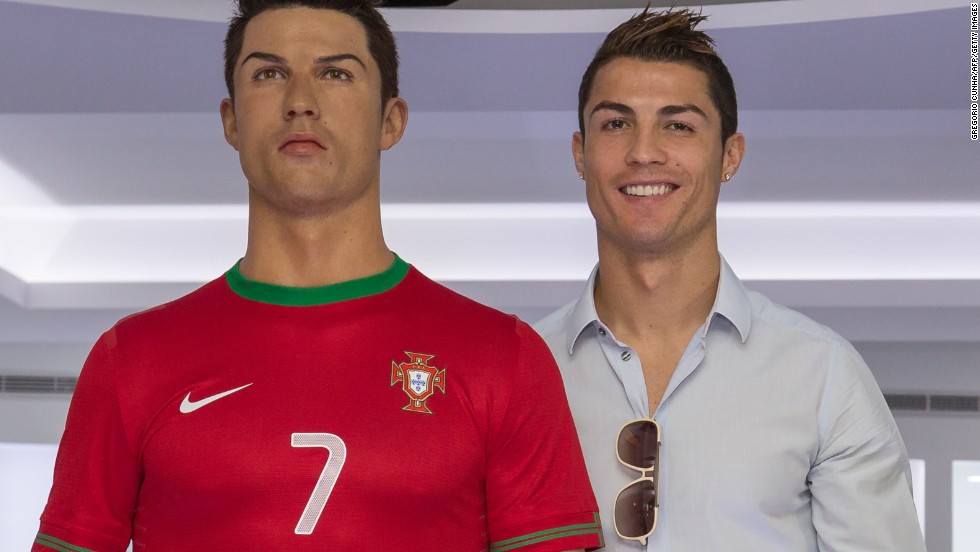 Cristiano Ronaldo stands next to a wax figure of himself at the opening of a museum dedicated to his football career in his Portuguese hometown.