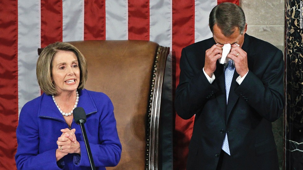 On January 5, 2011, Boehner wipes away tears as he waits to receive the gavel from outgoing House Speaker Nancy Pelosi, D-California, during the first session of the 112th Congress.