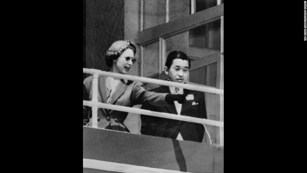 Queen Elizabeth II and Akihito are seen in the royal box at the Epsom Downs Racecourse on June 6, 1953, in England. Crown Prince Akihito made the trip to attend her coronation.