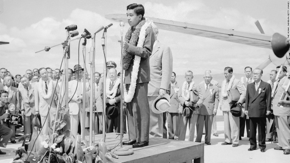 Akihito addresses the crowd upon arrival at Oahu Airport on October 8, 1953, in Honolulu. During seven months of travel, the crown prince visited 14 countries.