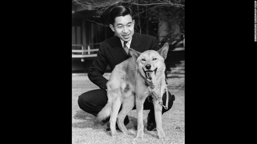 Akihito with his pet dog Dingo in December 1963, on the grounds of Togu Palace, his residence in Tokyo.