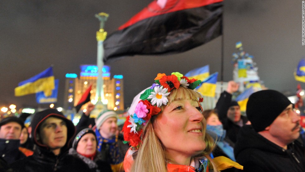 A girl wearing a traditional Ukrainian wreath attends an opposition rally in Independence Square on December 17.