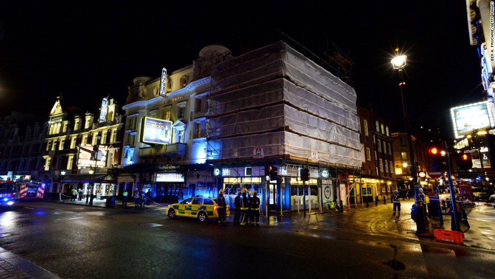 Emergency service personnel work outside London&#39;s Apollo Theatre on Thursday, December 19. Part of the theater&#39;s ceiling collapsed during a performance Thursday night, injuring dozens of people, officials said.