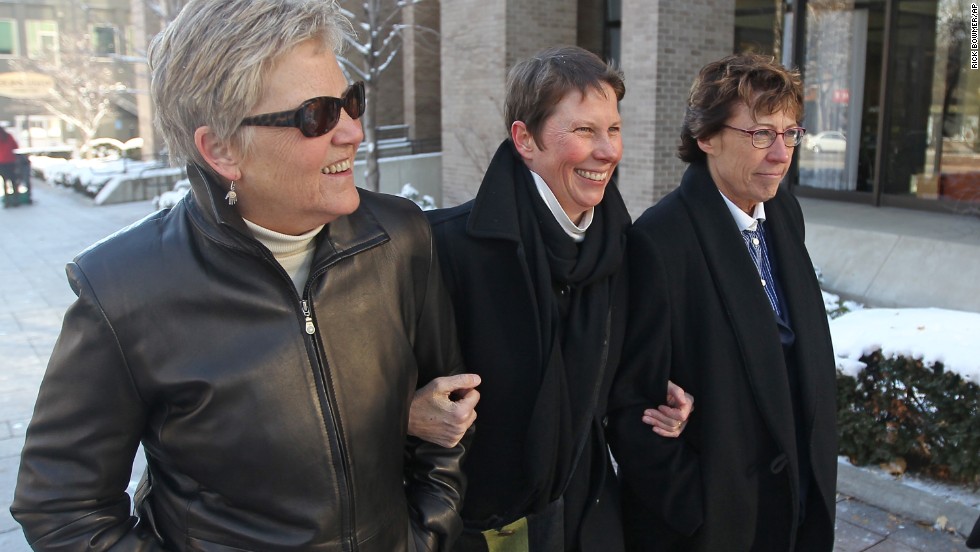 Plaintiffs Laurie Wood, left, and Kody Partridge, center, walk with attorney Peggy Tomsic on December 4, 2013, after a judge heard arguments challenging Utah&#39;s same-sex marriage ban.
