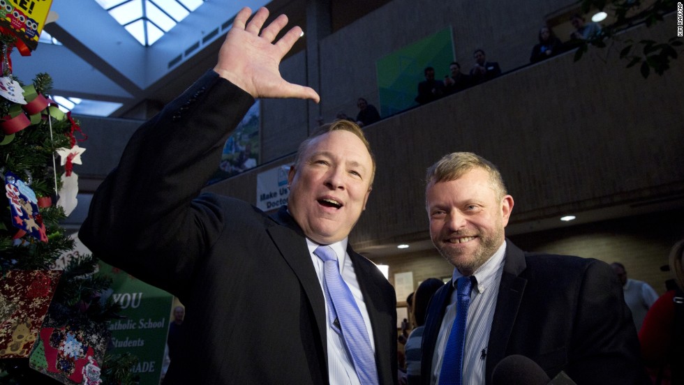 Utah state Sen. Jim Dabakis, left, and Stephen Justesen acknowledge the crowd after being married in Salt Lake City in December 20, 2013.