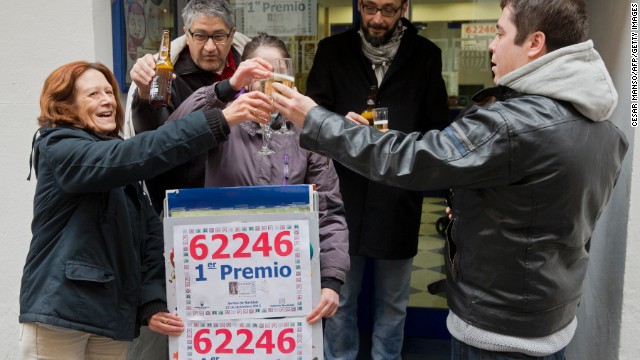 Lottery Administration owners and locals celebrate having sold a first prize ticket in Spain&#39;s Christmas lottery named &quot;El Gordo&quot; (Fat One) in Palencia on December 22, 2013.