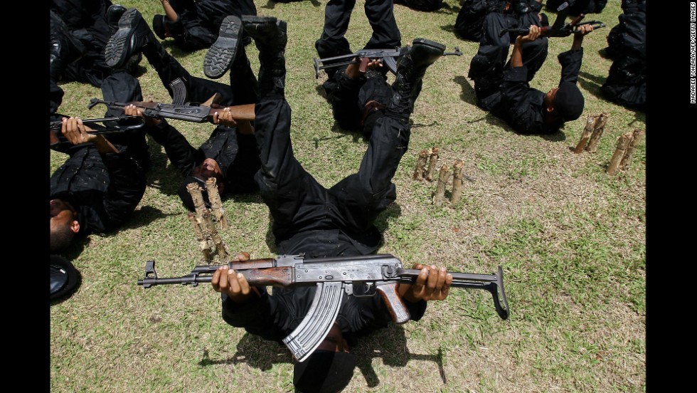 Newly recruited Rangers practice with their AK-47s during a training session at a military camp in the southern Narathiwat province of Thailand in 2009.
