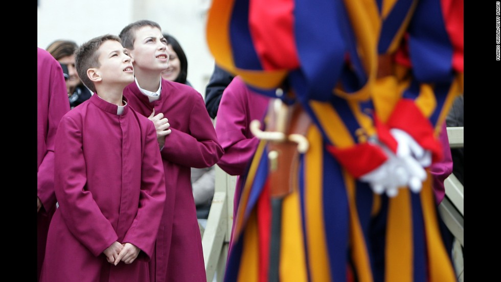 Altar boys in St. Peter&#39;s Square attend the Pope&#39;s Christmas Day message. The Pope said he is wishing for a better world, with peace for the land of Jesus&#39; birth, for Syria and Africa as well as for the dignity of migrants and refugees fleeing misery and conflict.