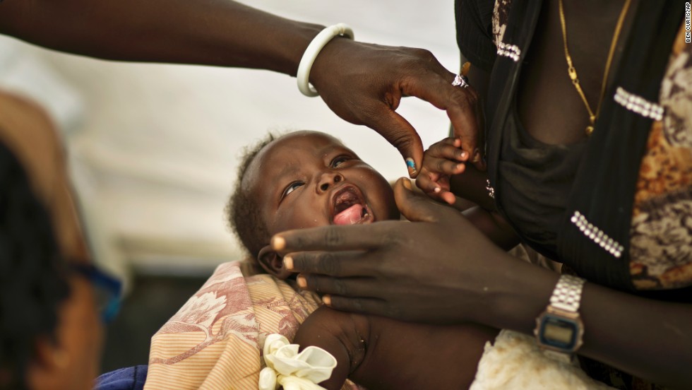 One-month-old Nhial Hoan Malual receives treatment for dehydration and chest pains in a medical tent run by Doctors Without Borders at the U.N. compound in Juba on December 27. 