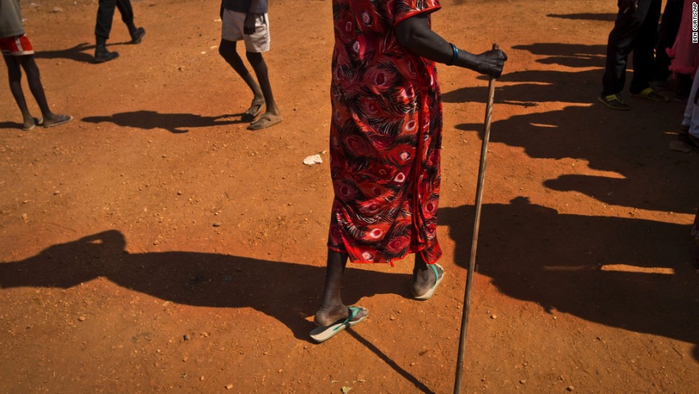 A woman carries items on her head through the U.N. compound in Juba on December 27. 