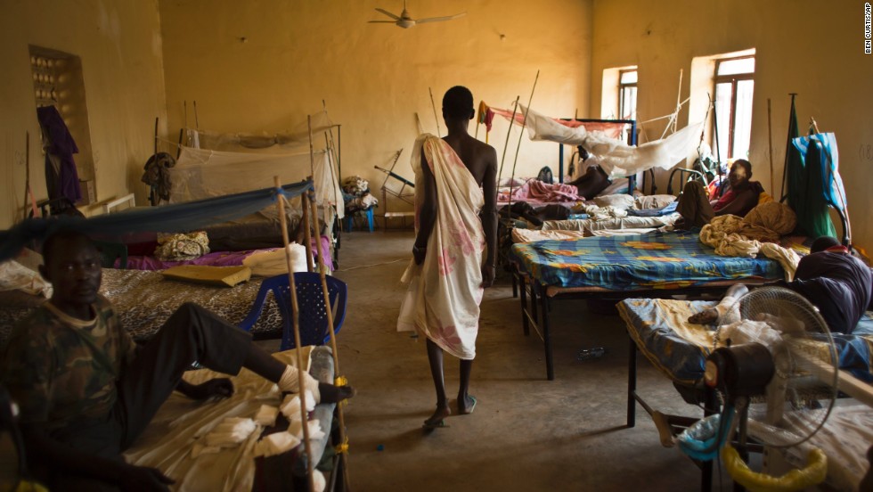 A man walks in a ward where most patients are soldiers with gunshot wounds inside the Juba Military Hospital in Juba on Saturday, December 28.