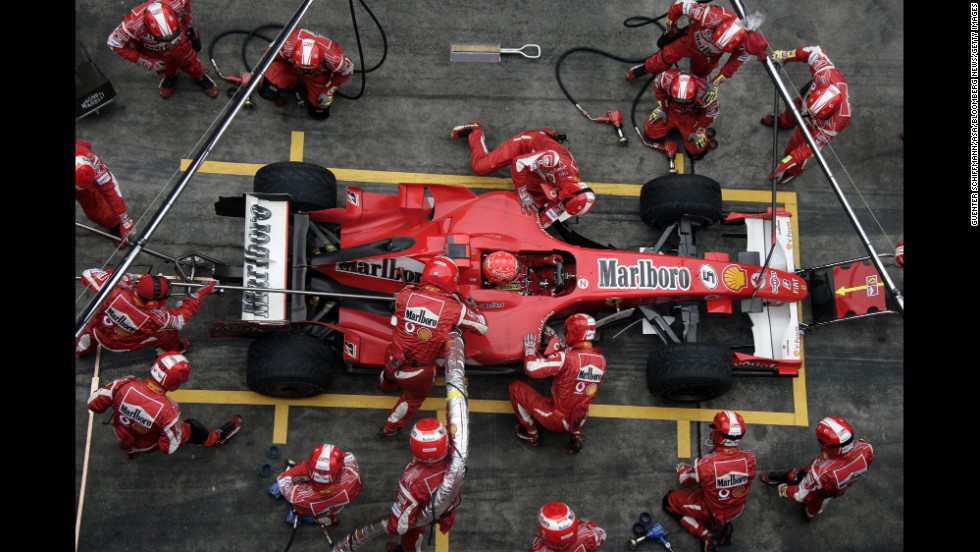 Schumacher&#39;s pit team works on his car during the Formula 1 Grand Prix of China in Shanghai in 2006.
