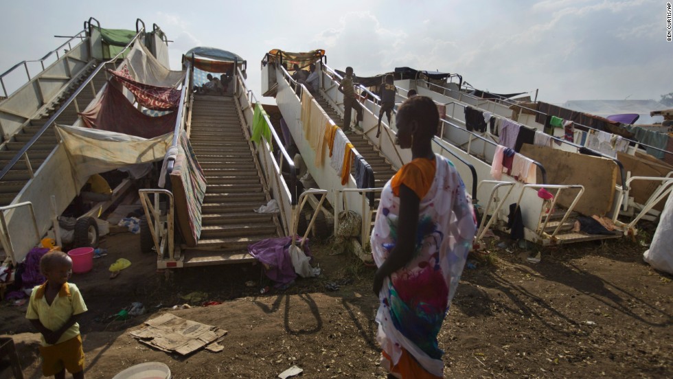 Moveable stairs used for passengers to board aircraft are repurposed into makeshift shelters at a U.N. compound in Juba on December 29.