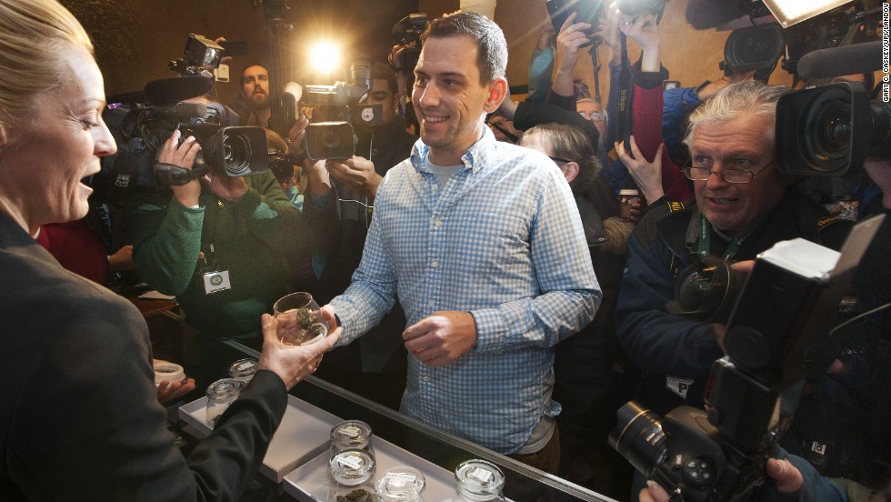 Sean Azzariti, an Iraq war veteran and marijuana activist, becomes the first person to legally purchase recreational marijuana in Colorado on January 1, 2014. Colorado was the first state in the nation to allow retail pot shops. &quot;It&#39;s huge,&quot; Azzariti said. &quot;It hasn&#39;t even sunk in how big this is yet.&quot;