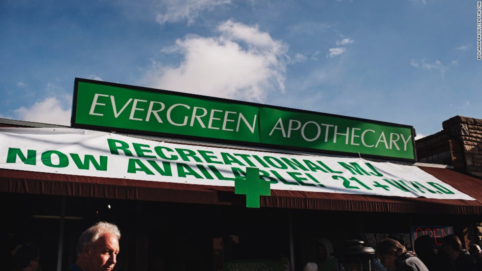 People line up to buy recreational marijuana outside of Evergreen Apothecary.