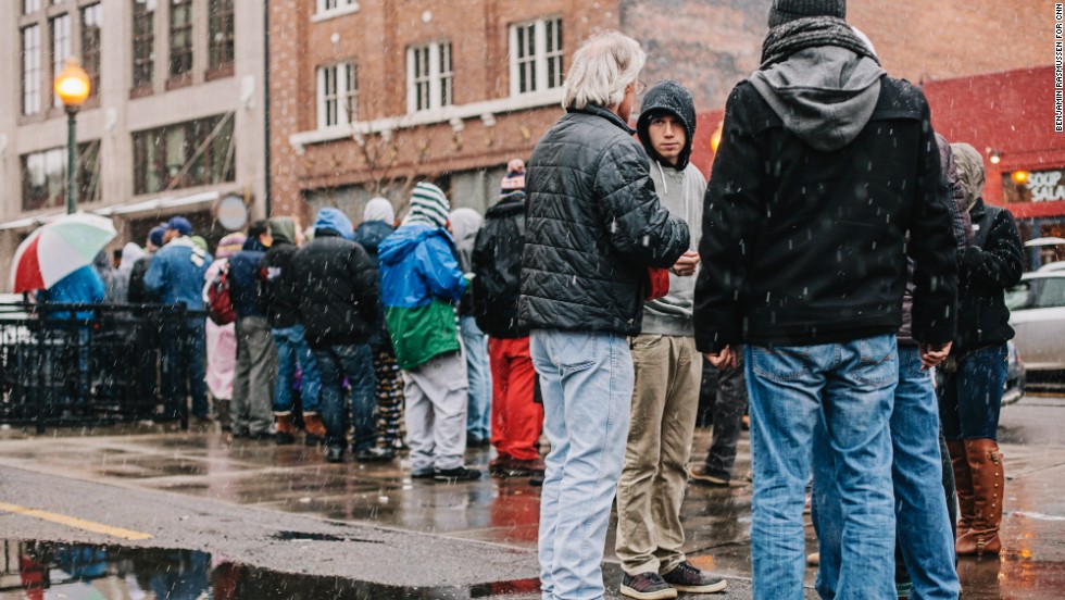 Customers wait in a long line for their turn to buy recreational marijuana outside the LoDo Wellness Center on Wednesday, January 1, in Denver. Colorado is the first state in the nation to allow retail pot shops.
