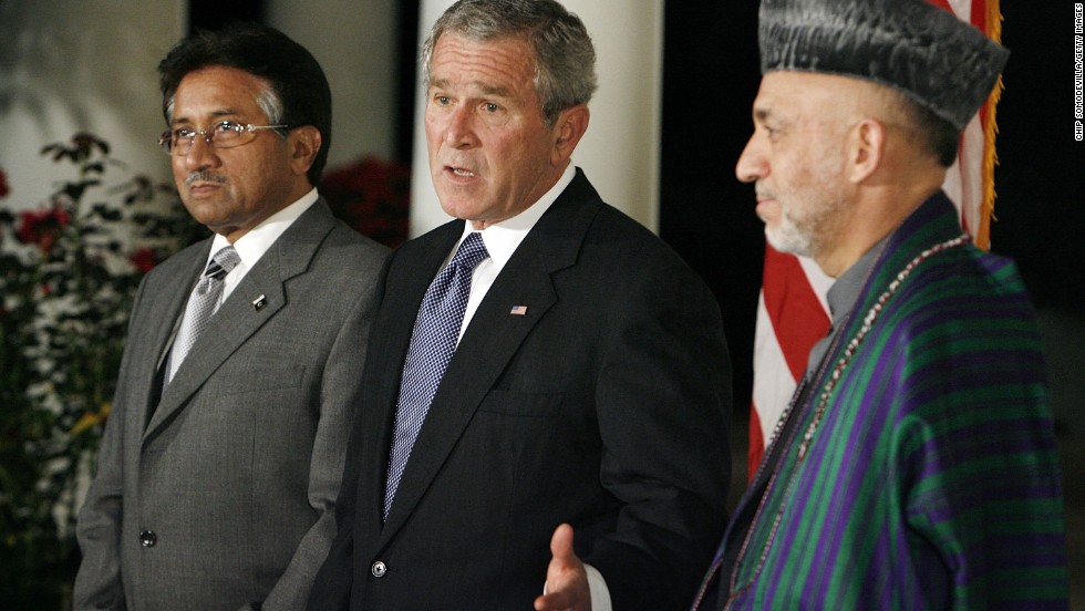 Musharraf, then-U.S. President George W. Bush and Afghanistan President Hamid Karzai stand in the Rose Garden of the White House as Bush delivers remarks in 2006.