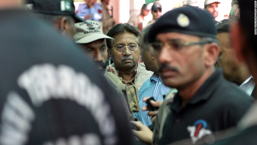 Musharraf is escorted by soldiers as he arrives at an anti-terrorism court in Islamabad on April 20, 2013. A Pakistani court rejected Musharraf&#39;s request for a bail extension, and Musharraf was put under house arrest.