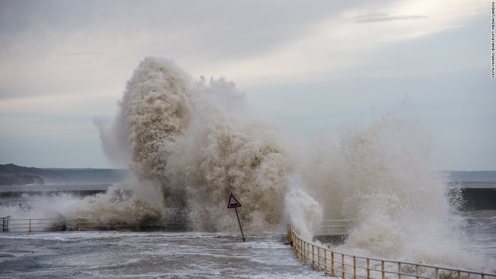 Huge waves batter the seaside and promenade at Aberystwyth on January 4 in Wales. 