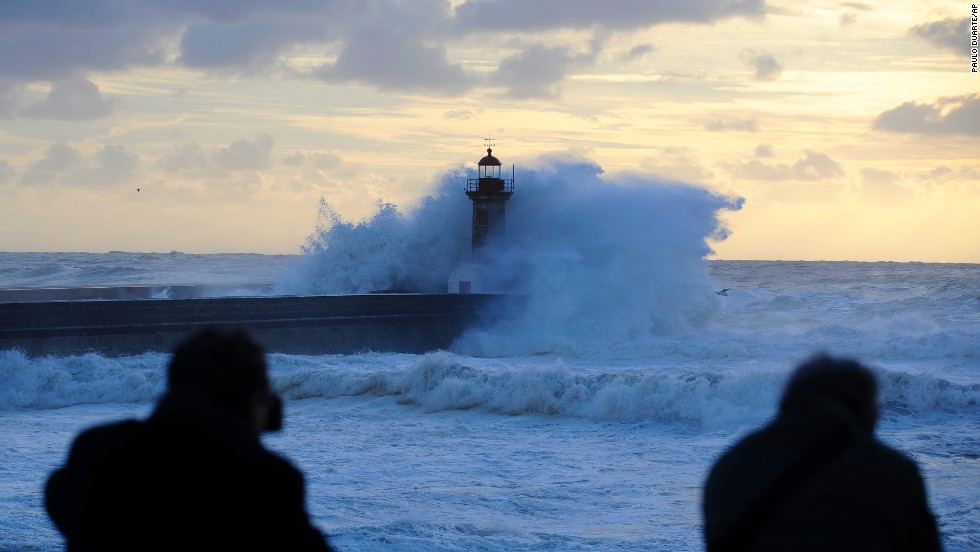 Heavy seas cause waves to crash over a lighthouse at the mouth of the Douro River in Porto, Portugal, on January, 4. 