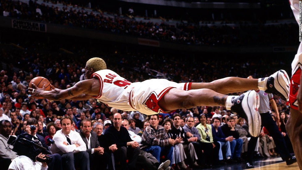 Rodman dives for a loose ball during a game in 1997. Rodman is one of the NBA&#39;s all-time greatest rebounders, leading the league in that category from 1992 to 1998.