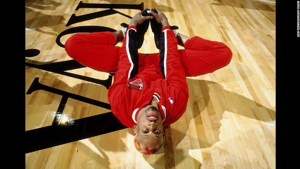 Rodman stretches before a game in Seattle in 1996.