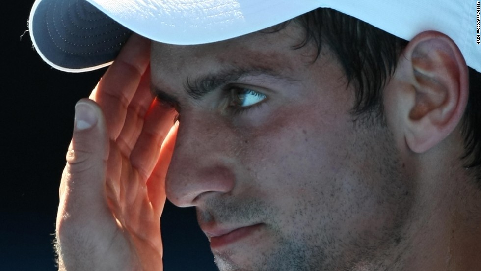 Novak Djokovic contemplates his fate ahead of his retirement with heat exhaustion in a quarterfinal match against Andy Roddick at the Australian Open in 2009.