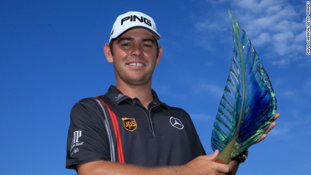 Louis Oosthuzen shows off the winning trophy after the South African won the European Tour event in Durban.
