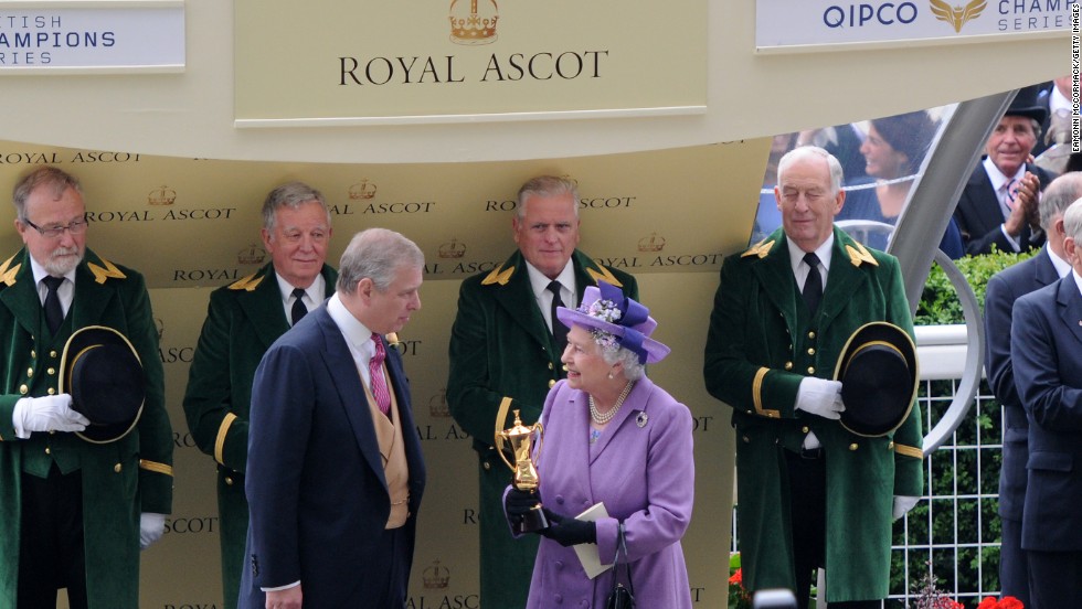 The British monarch receives the winning trophy for the Ascot Gold Cup last year after her horse Estimate won the prestigious race. 
