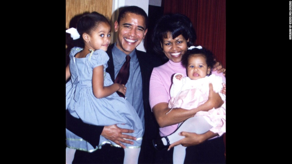 The Obamas are seen with daughters Malia and Sasha at Sasha&#39;s christening. Sasha was born on June 7, 2001.