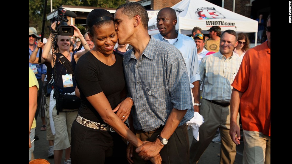 Barack Obama gives his wife a playful kiss as they tour the Iowa State Fair in Des Moines, Iowa, in August 2007. Obama was campaigning at the time for the Democratic presidential nomination.