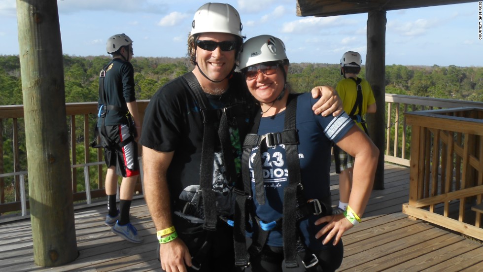 Gabi and David Rose ride a zip-line roller coaster in St. Cloud, Florida, to celebrate their weight loss. 