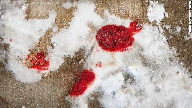 Blood is frozen in snow in Chicago&#39;s Logan Square neighborhood after a 68-year-old man was shot to death.