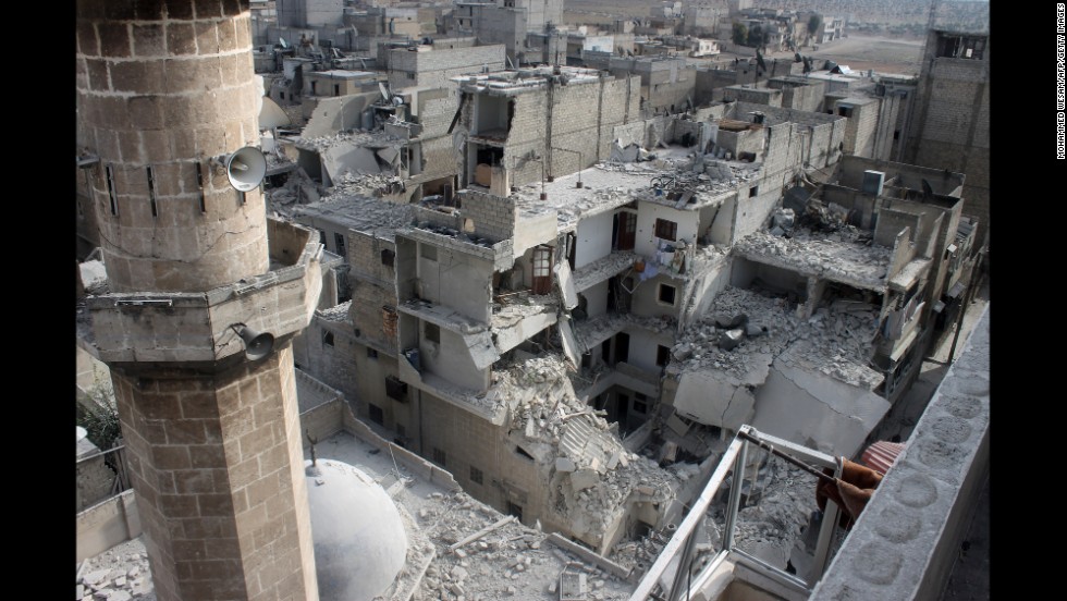 Buildings lie in ruins in Aleppo on Sunday, January 19, after reported air raids by Syrian government planes.