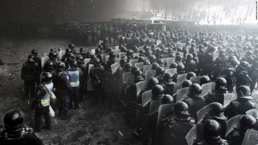 Riot police officers gather as they clash with protesters in the center of Kiev on January 22.