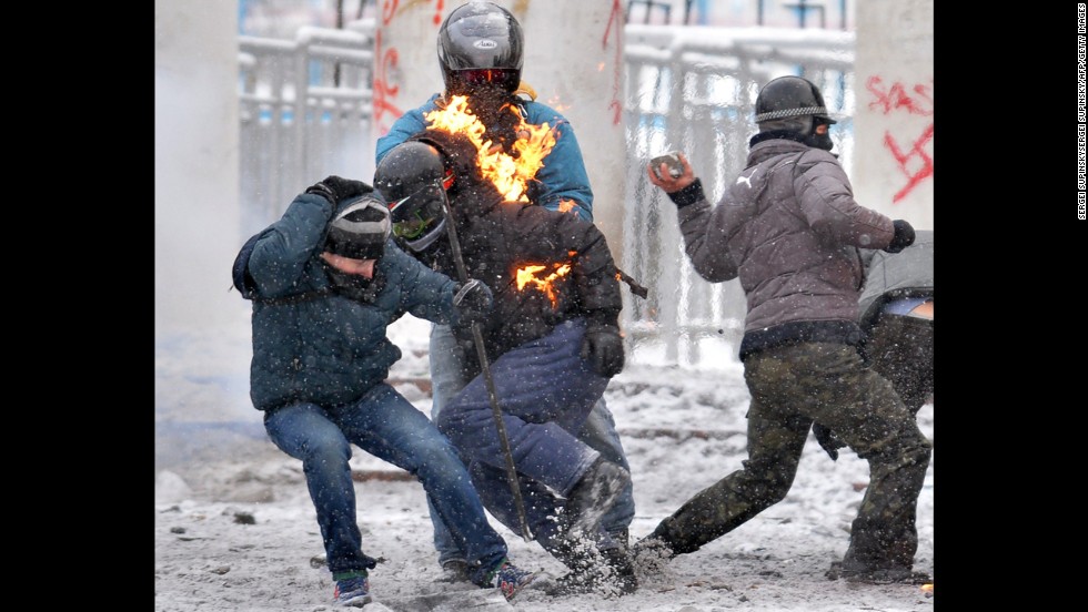 Flames leap off a protester during clashes with police on January 22.